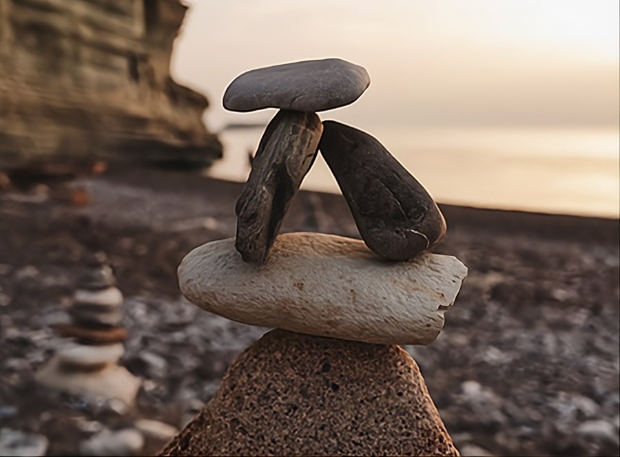 Stacked stones on a rocky beach.